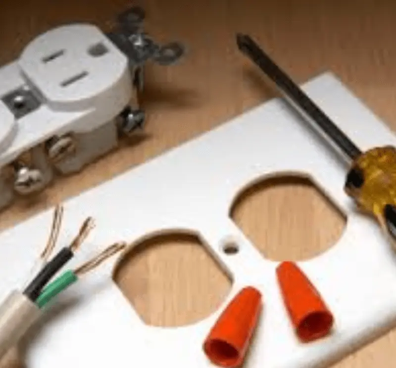 Electrical plugin outlet plate with tools and wires